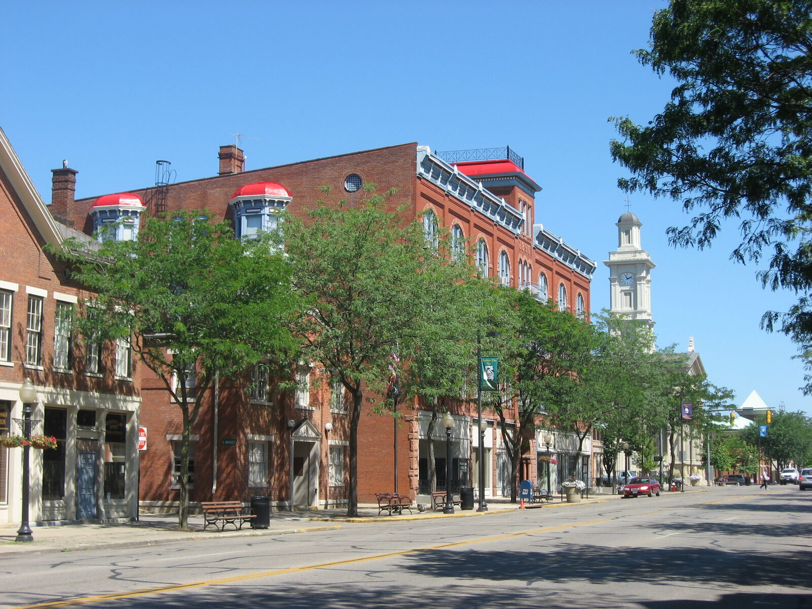 Historic buildings along South Paint Street in downtown Chillicothe, Ohio with the courthouse clock tower in the distance