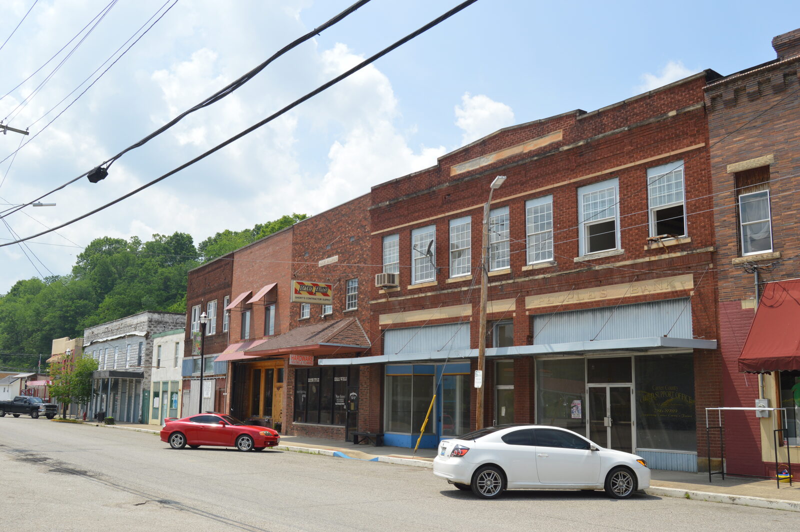 Historic brick storefronts along the main street of Olive Hill, Kentucky