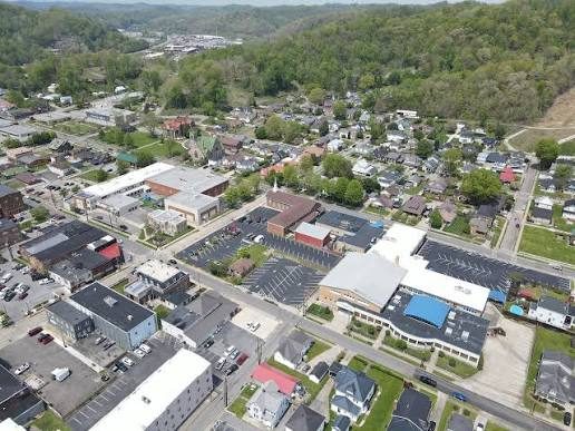 Aerial view of downtown Paintsville, Kentucky with local shops and Appalachian hills in the distance